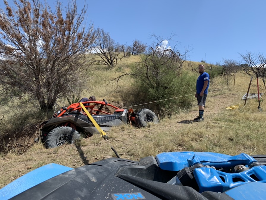 Winching a side-by-side out of rough desert terrain